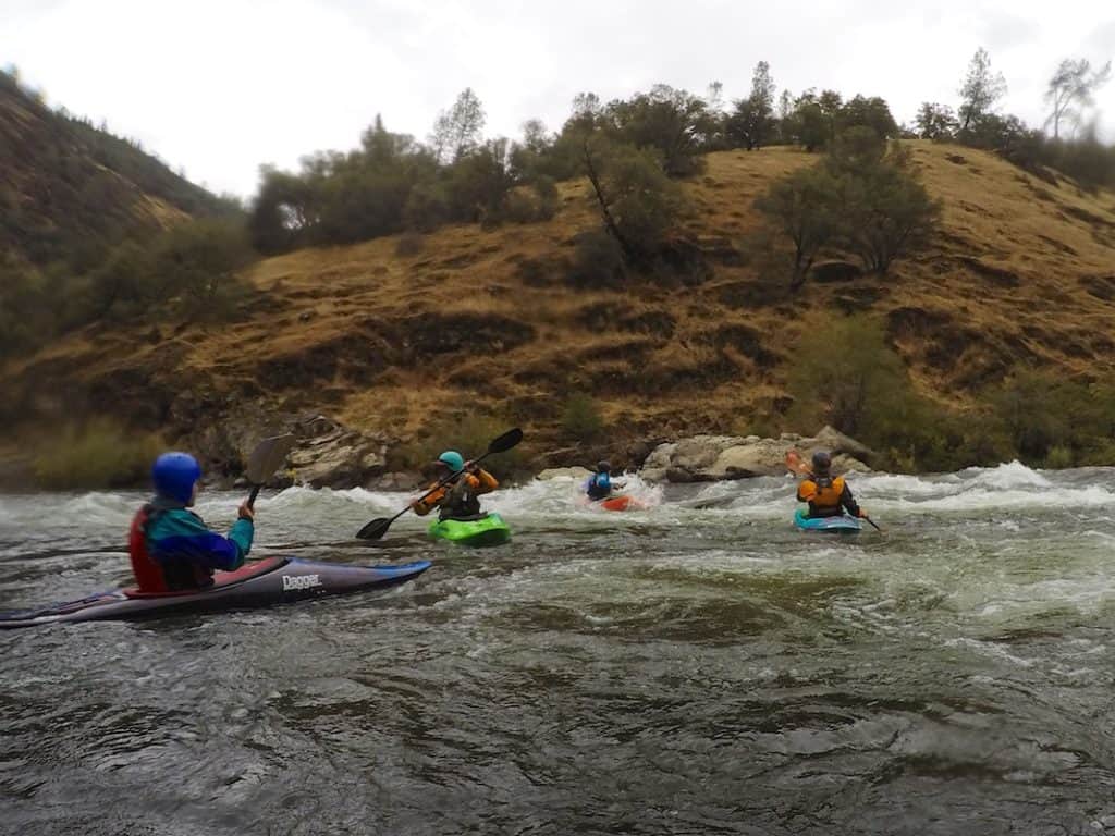 Kayakers surfing at Maya Rapid on the South Fork