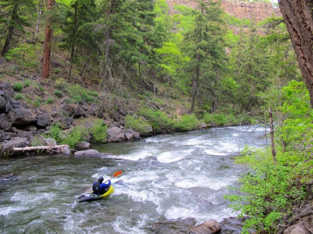 Kayaking on Oregon's White River below Keeps Mill