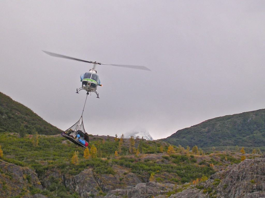 Helicopter portaging rafting gear around Turnback Canyon