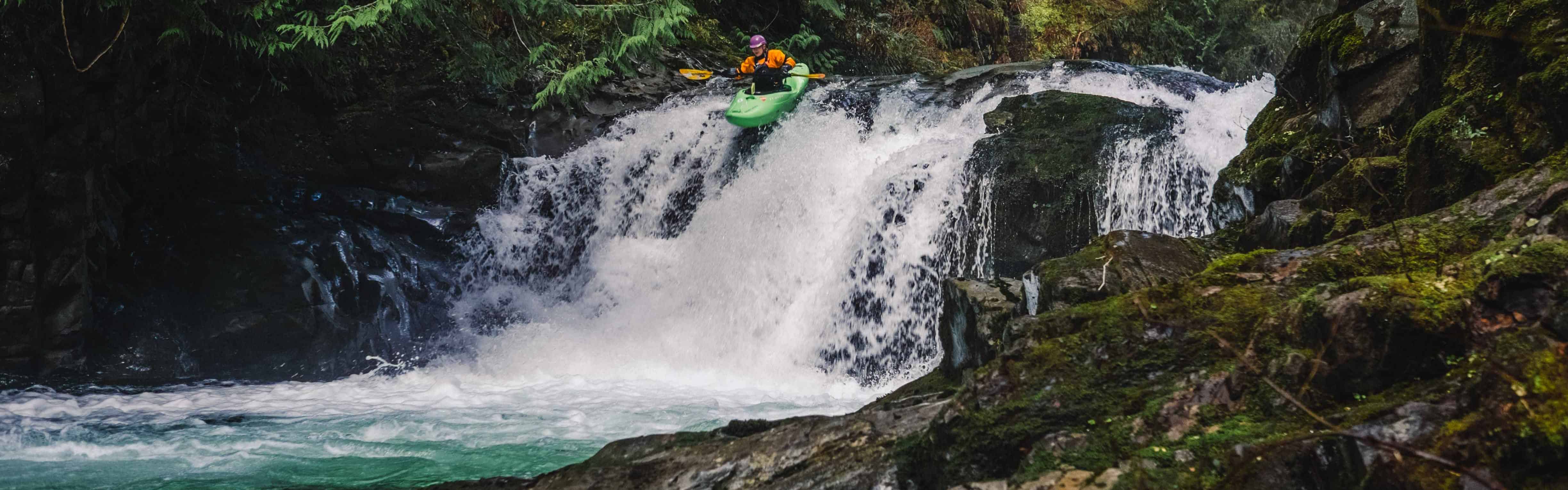 A paddler drops over one of the Sitkum’s clean waterfalls. Photo by Nate Wilson Photography