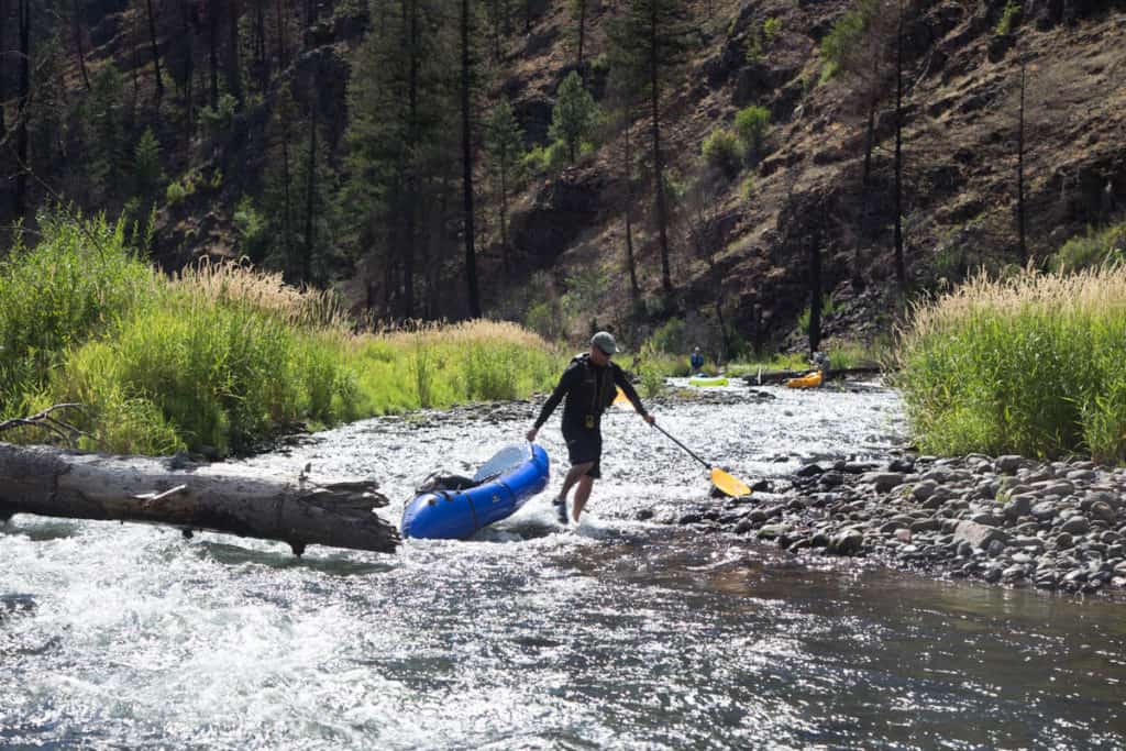 Portaging one of the wood hazards on the Wenaha River