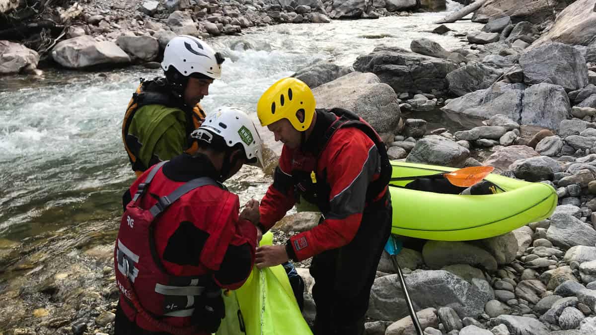 Repairing a BakRaft on an expedition in Bhutan