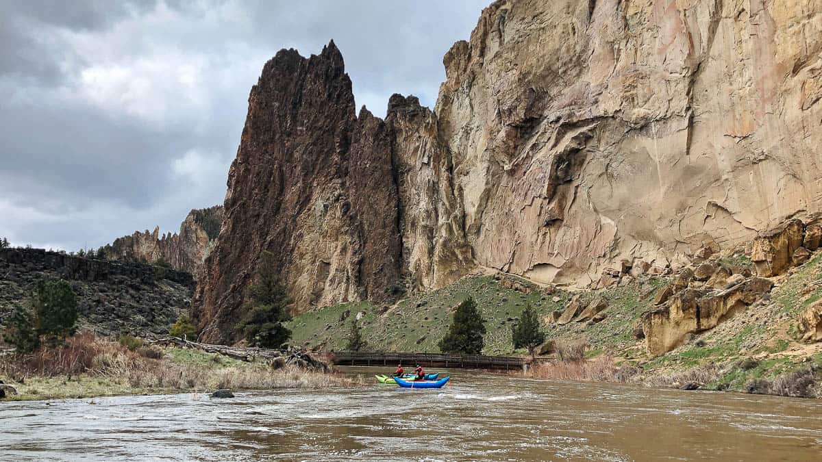 Paddling under the footbridge in Smith Rock State Park at 3400 cfs
