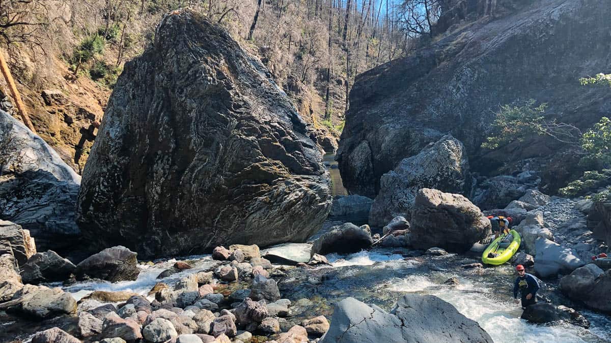 Portaging the bottom drop of Conehead Rapid