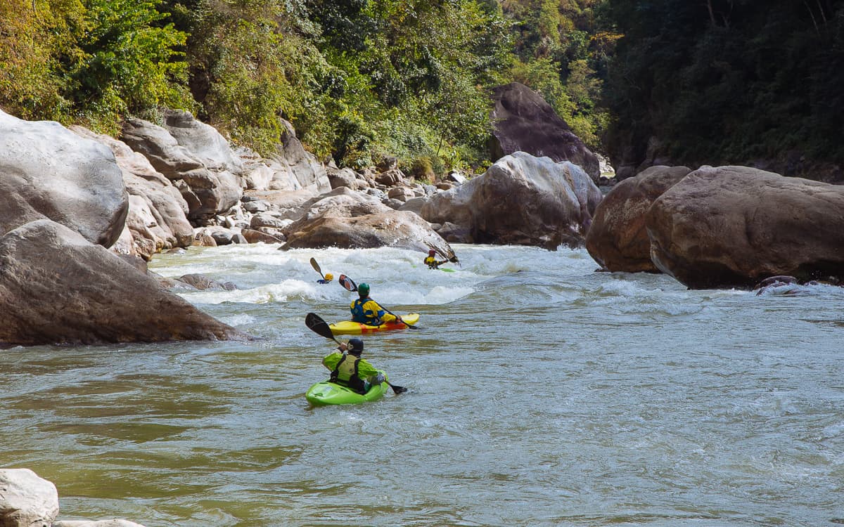 Kayaking the first rapid in Ema Dashi Canyon on the Mangde Chhu