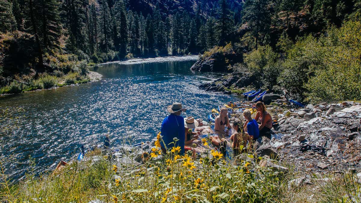 A group sits in Sunflower Hot Springs on the Middle Fork of the Salmon