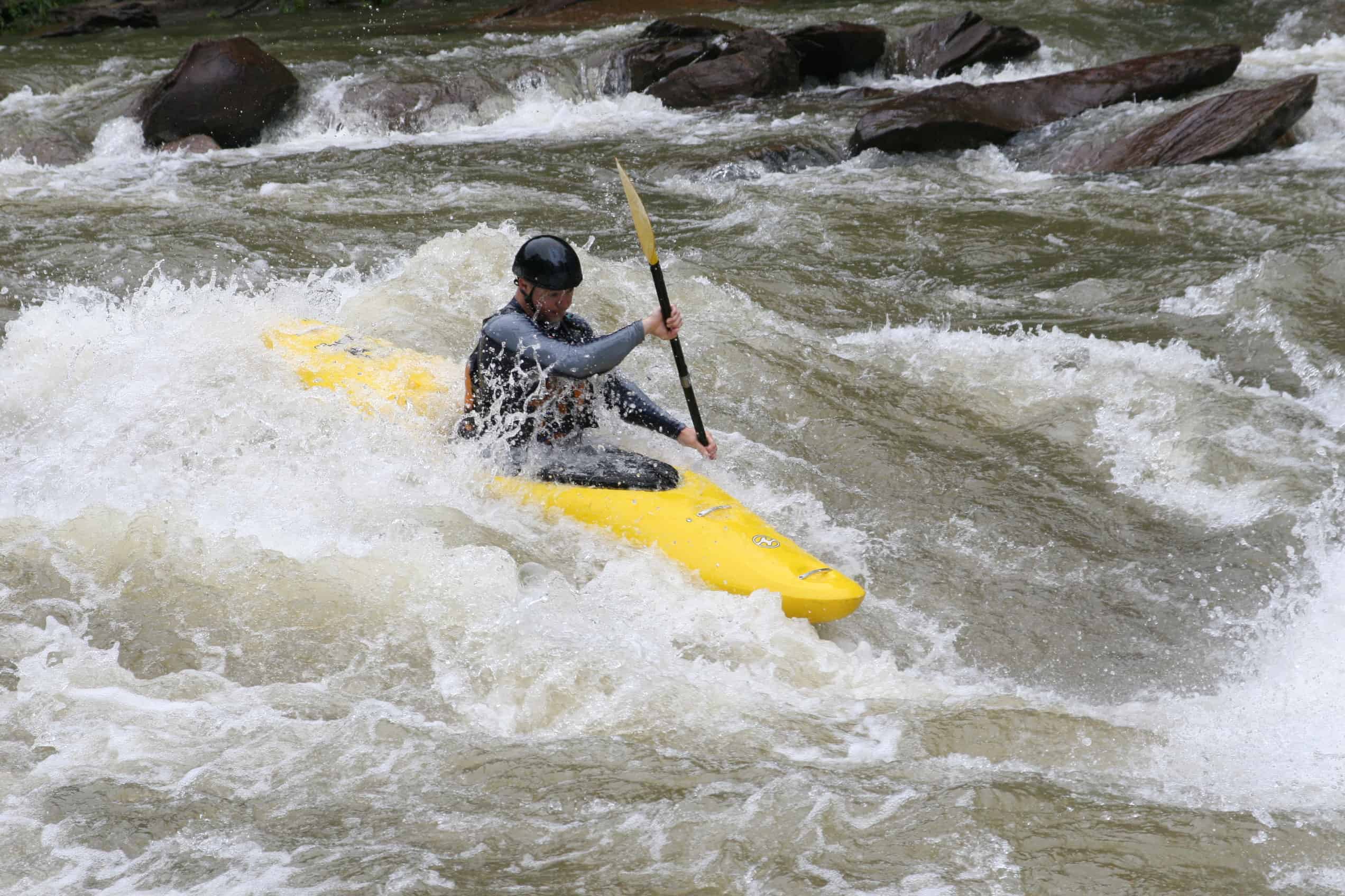 A kayaker runs Humongous on the Ocoee.