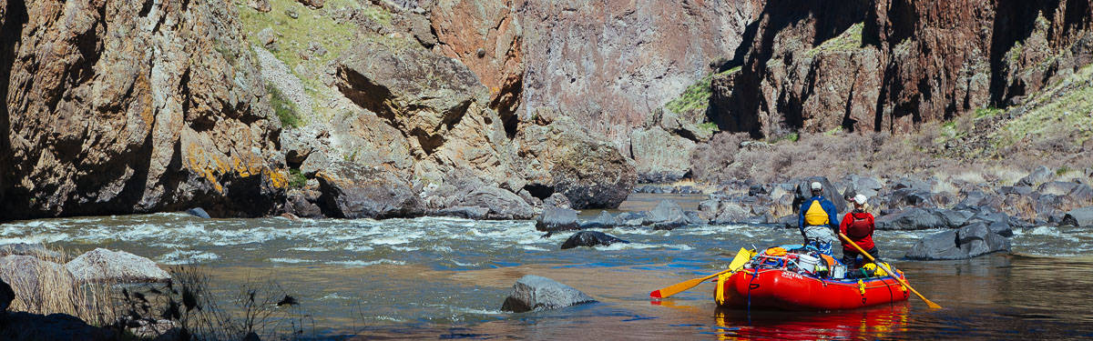 Boat scouting Montgomery Rapid on the Owyhee River