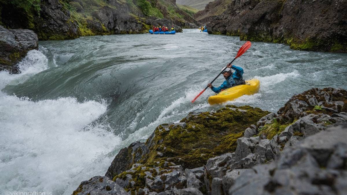 Kayaking the left line at Commitment Rapid on the East Glacial River
